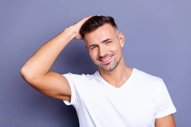 Man running a hand through his hair